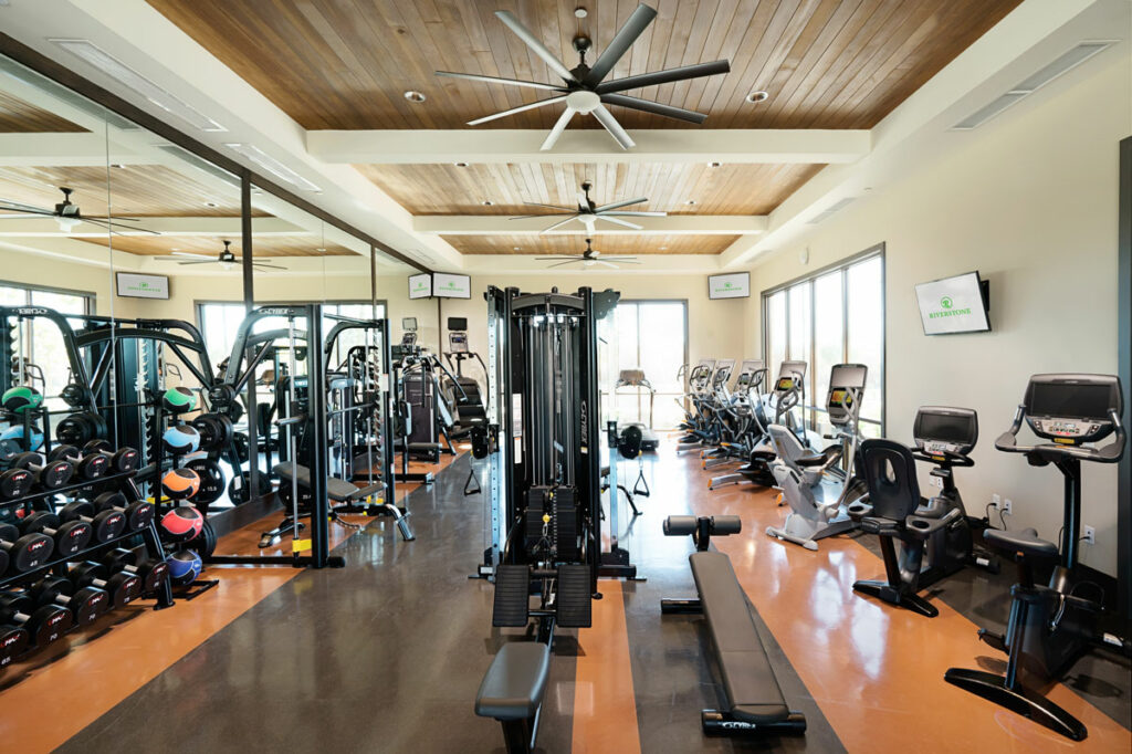 The Lodge at Riverstone offers an on-site gym with all-new equipment, including exercise bikes, ellipticals, several weight benches and machines, and free weights.