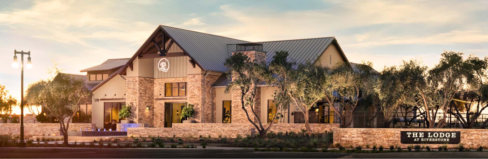 Exterior view of the Lodge at Riverstone, a community amenity available to Magnolia at Riverstone residents.